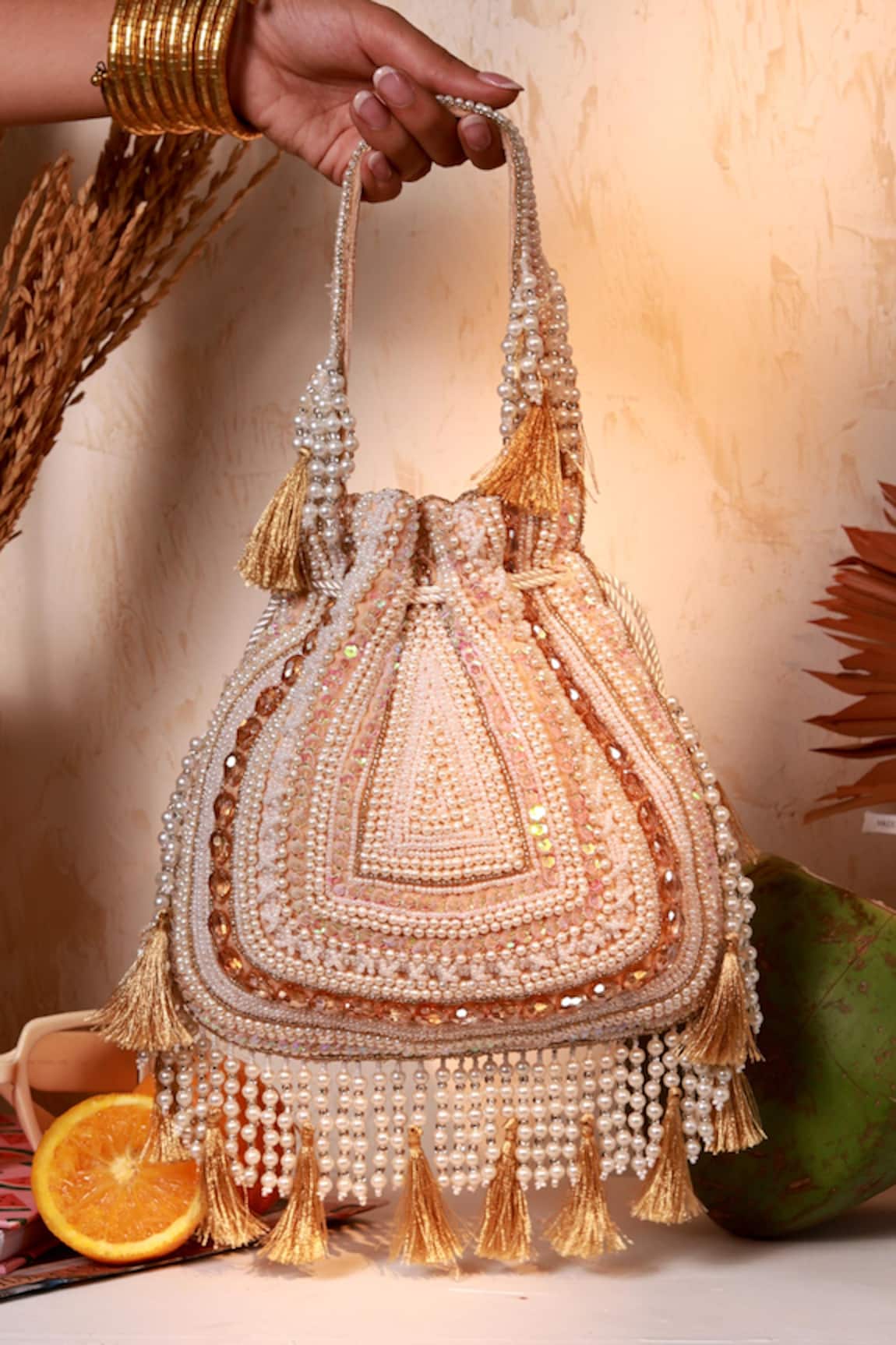 The Tan Clan Nora Beige Tasselled Potli Bag 