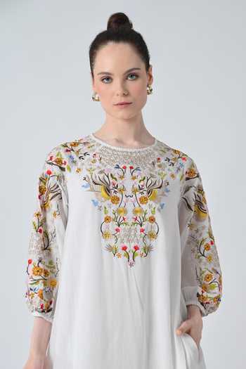 green emerald velvet dress A beautiful black dress featuring bold floral embroidery  Samant Chauhan