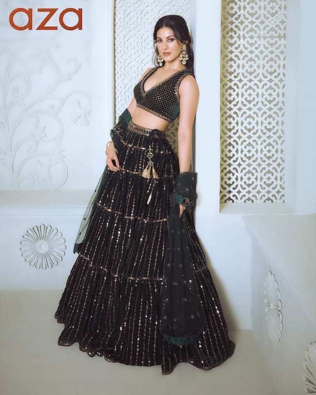 Amyra_Dastur_in_Deep_green_tiered_lehenga_with_all-over_embroidered_Paired_with_an_embroidered_sleeveless_blouse_and_cutwork_net_dupatta