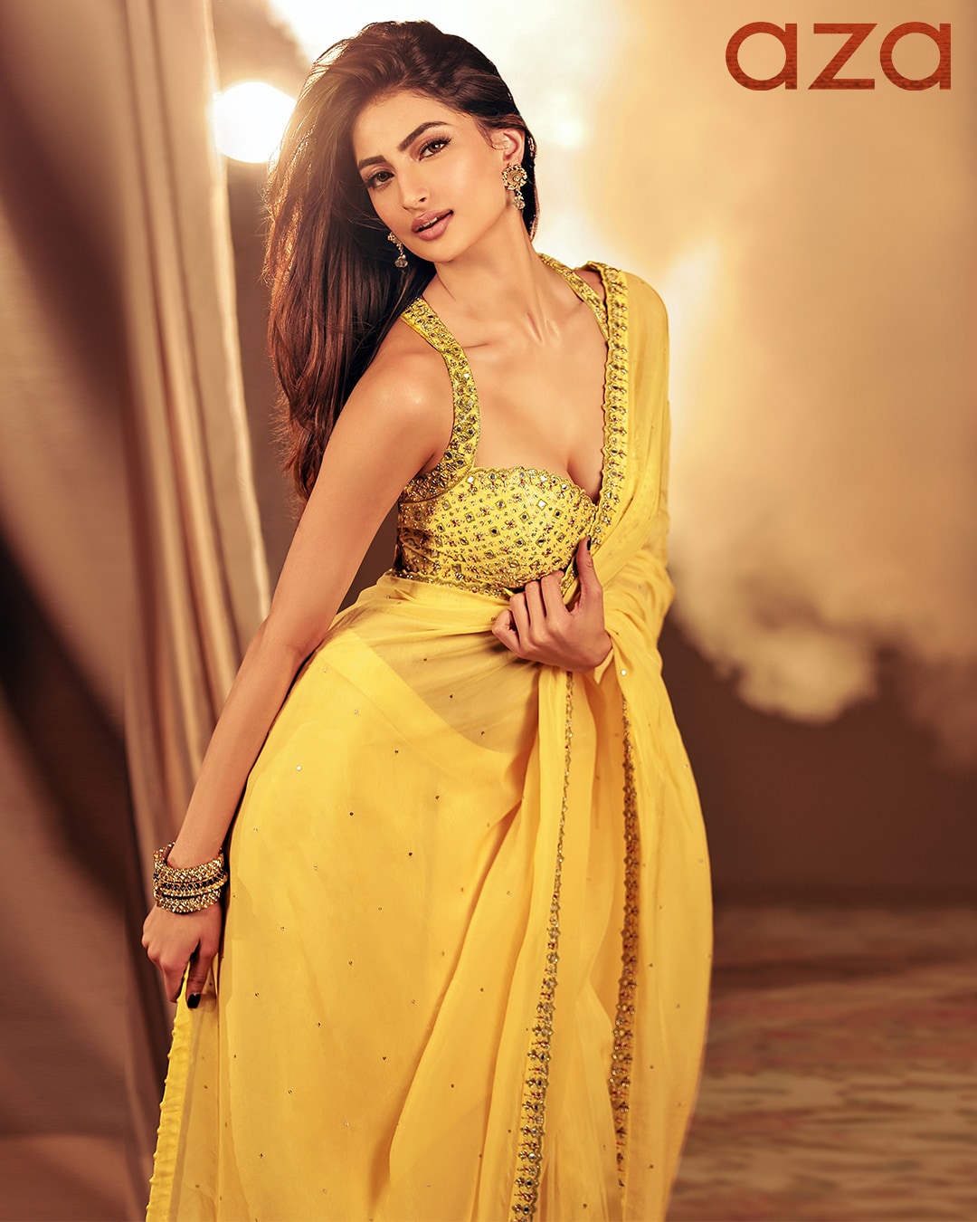 Palak_Tiwari_in_Yellow_pre-draped_saree_with_embroidery_on_the_border_and_tassels_at_the_end_Comes_with_embroidered_halter_neck_blouse