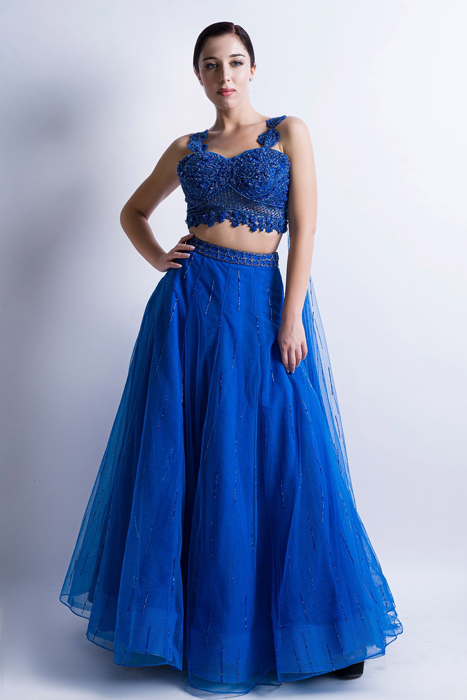 Sonaakshi Raaj Blue Swiss Net Embellished Skirt With Draped Blouse