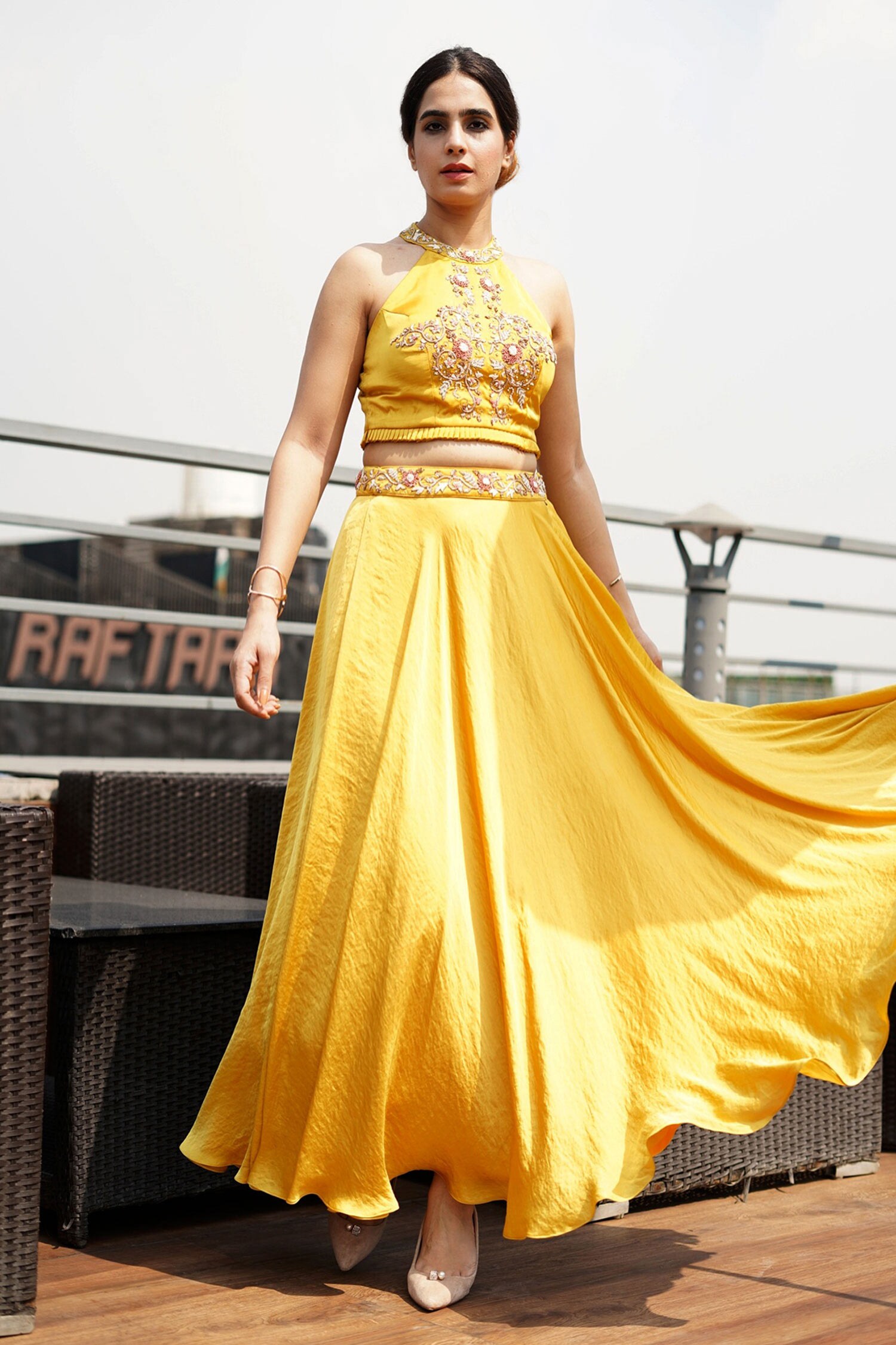 Buy Surabhi Arya Yellow Hammer Satin Halter Crop Top And Skirt Set