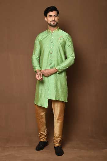MINT GREEN RAW SILK SHERWANI WITH IVORY KURTA AND TROUSER WITH OPTIONAL WORKED STOLE BELT AND JUTIS.
