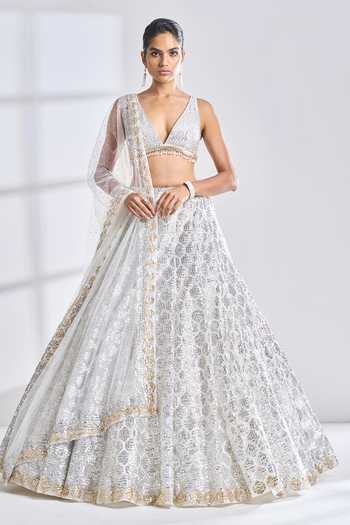 Sequined Halter Neck Top And Multicolour Shiny Lehenga With Net Dupatta main image 0