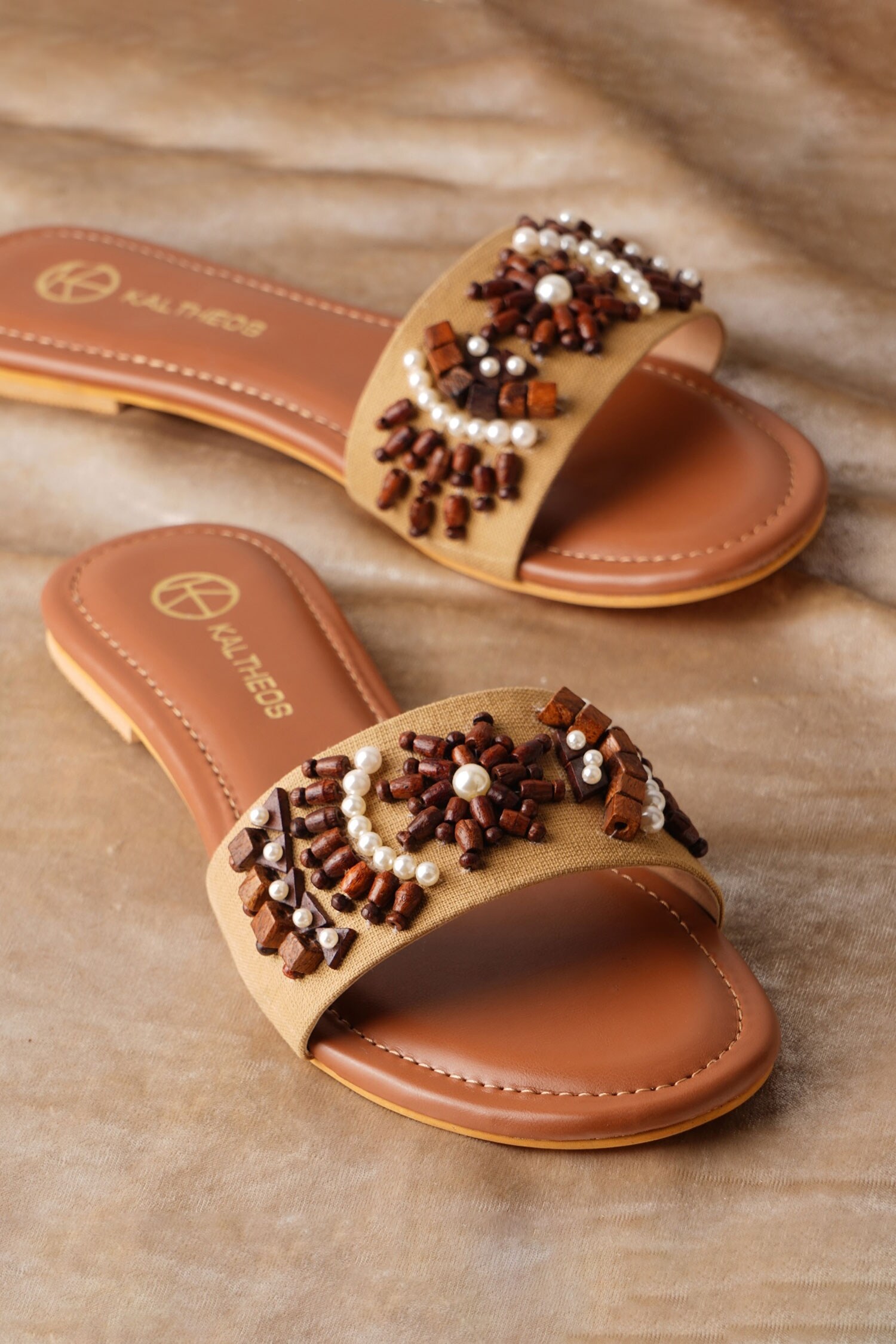 Buy Brown Embellished Mia Bead Flats by Kaltheos Online at Aza Fashions.