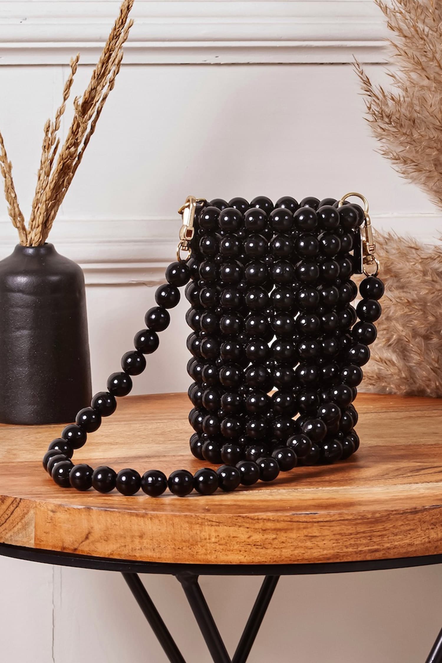 Buy Black Bead Bucket Bag by Waby Saby Online at Aza Fashions.