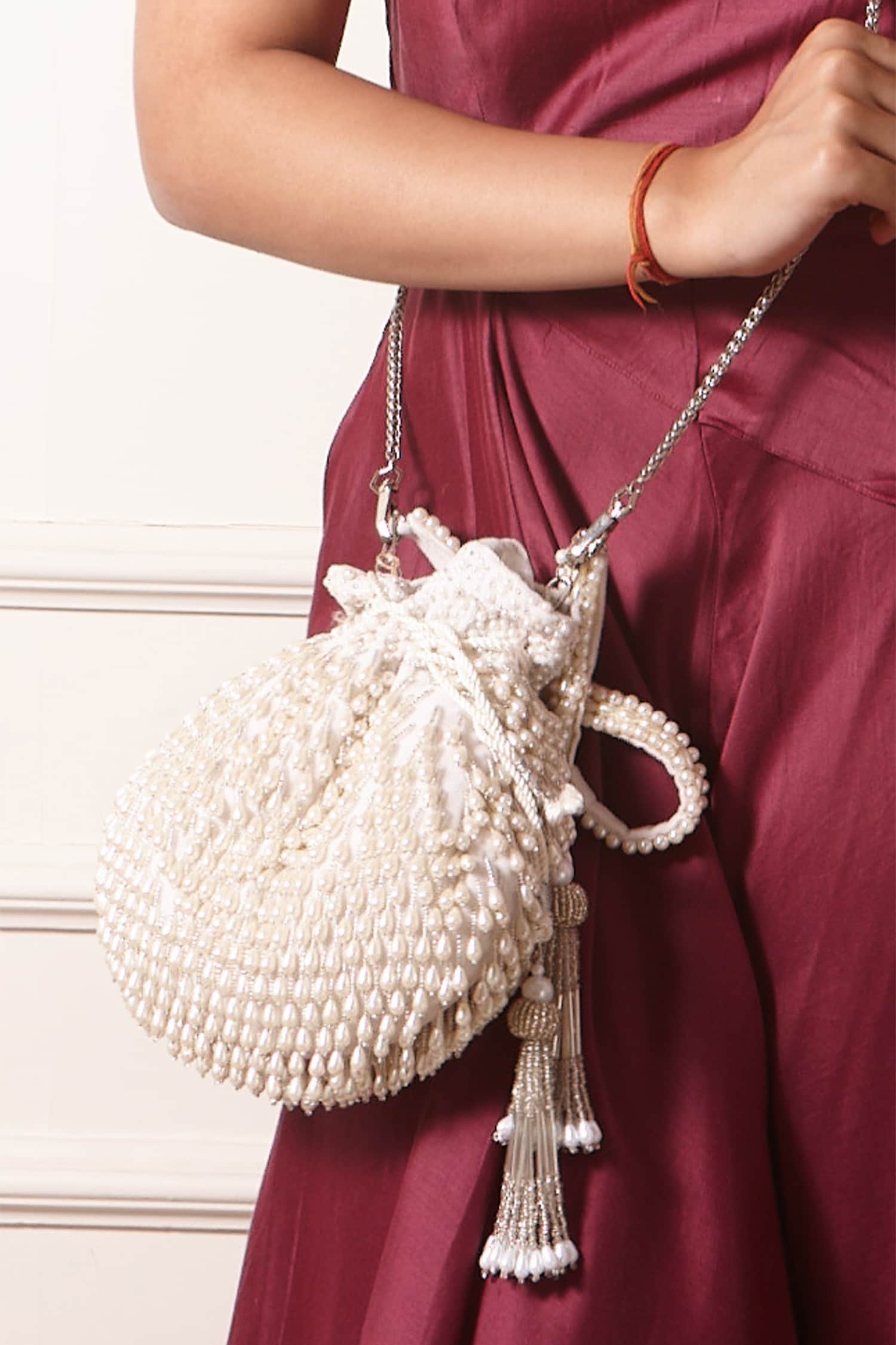 Buy White Embellished Pearl Drop Potli Bag by FOREVER NOOR Online at ...