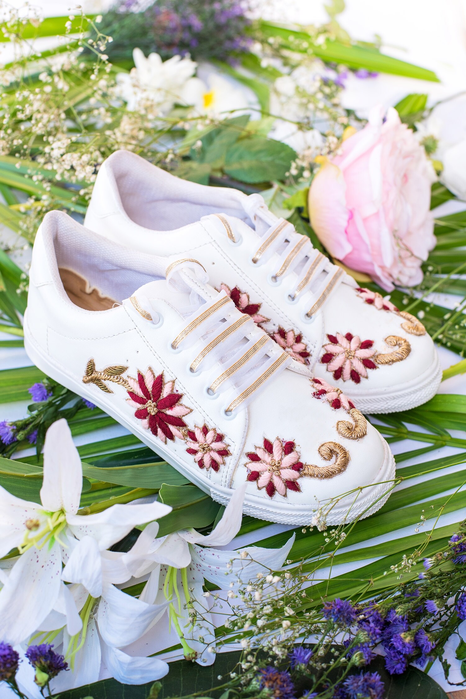 White shoes with embroidered 2025 flowers