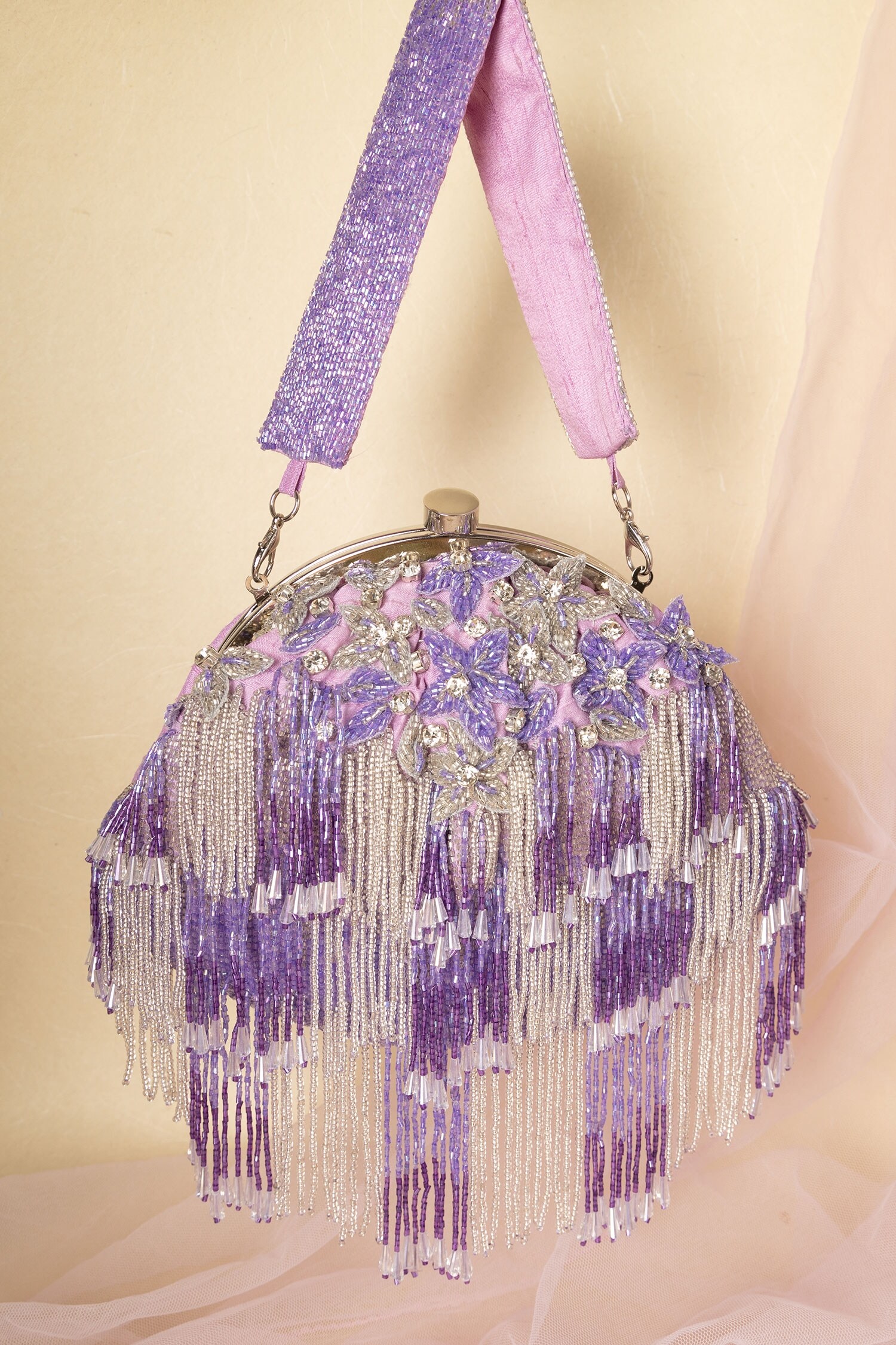 Buy Purple Embellished Tassel Potli by Ara Studio Online at Aza Fashions.