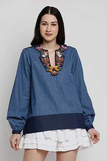 Navy blue shaped waist top with printed yoke, bell sleeves and gathered solid flare