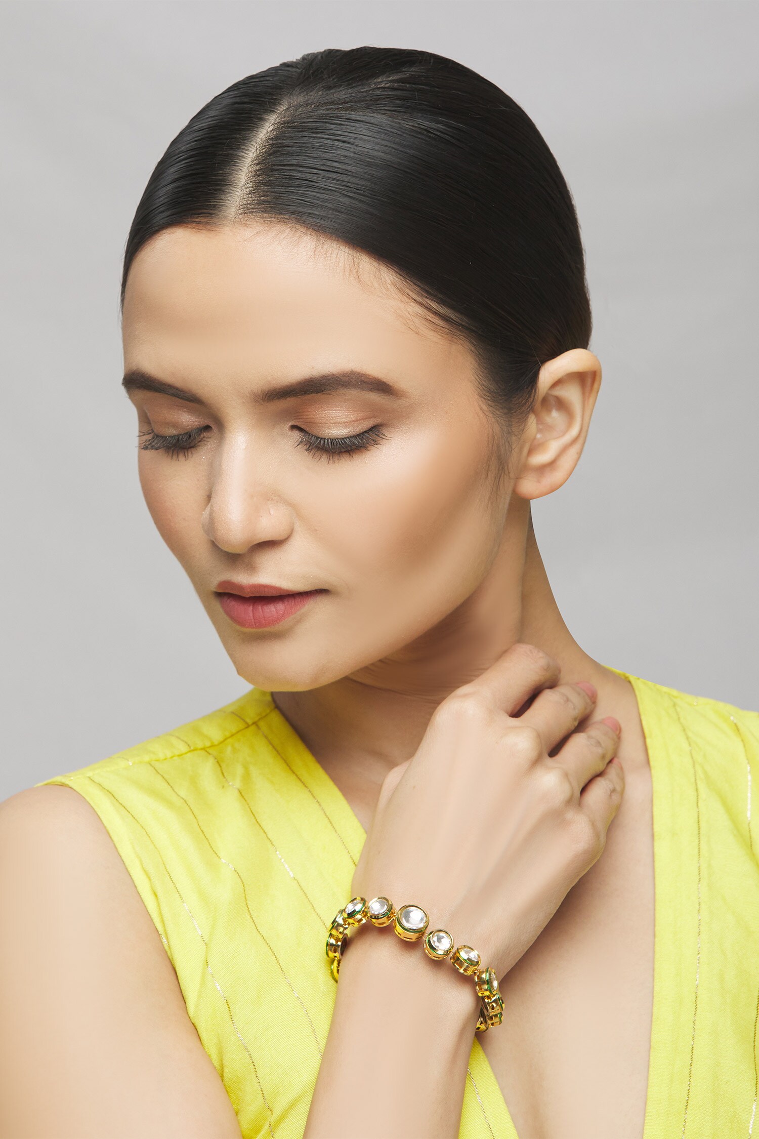 Buy Gold Plated Kundan Bracelet by Nayaab by Aleezeh Online at Aza Fashions.