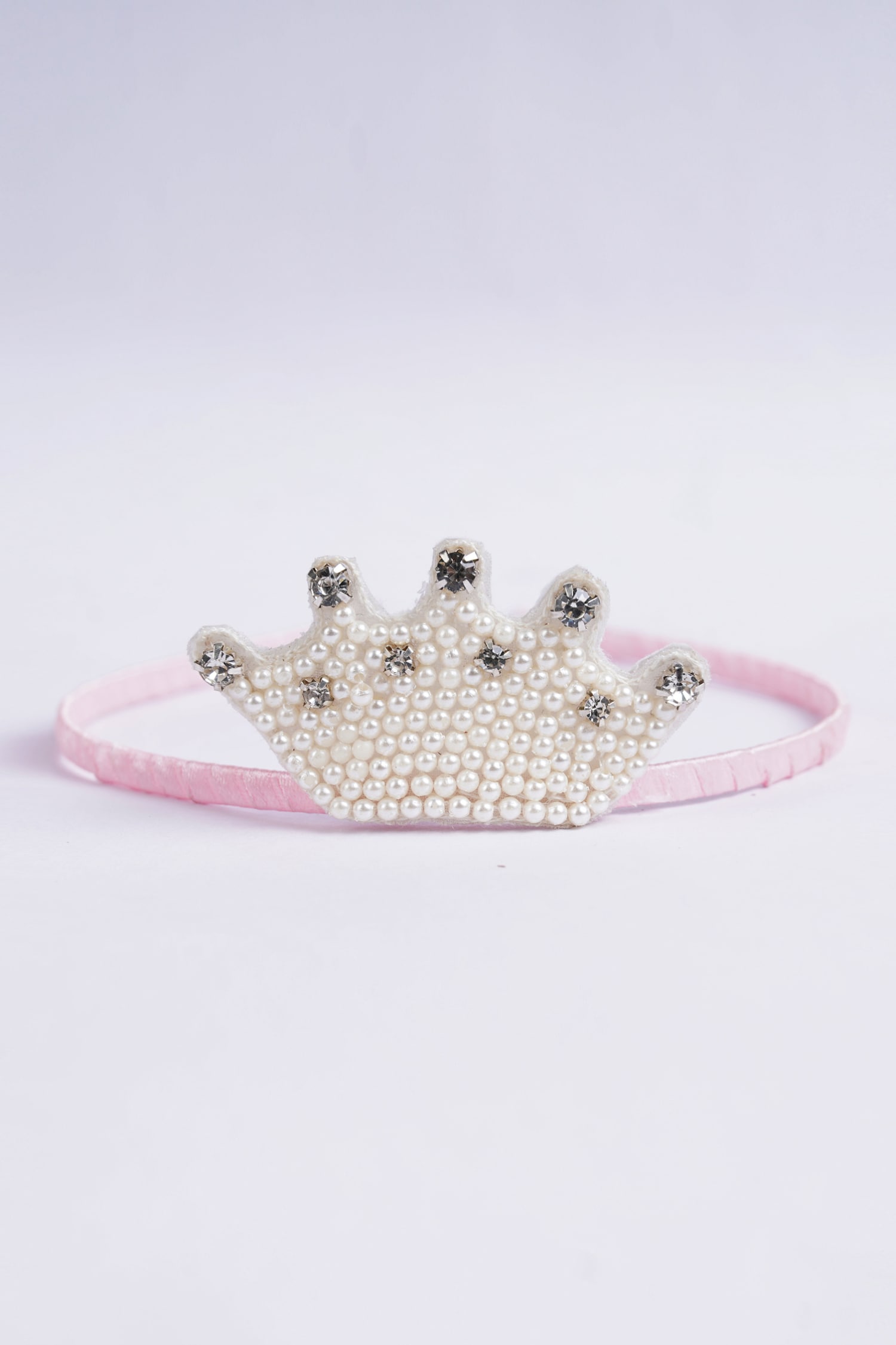 Buy Pink Enchanting Pearl Crown Hairband by Choko Online at Aza Fashions.