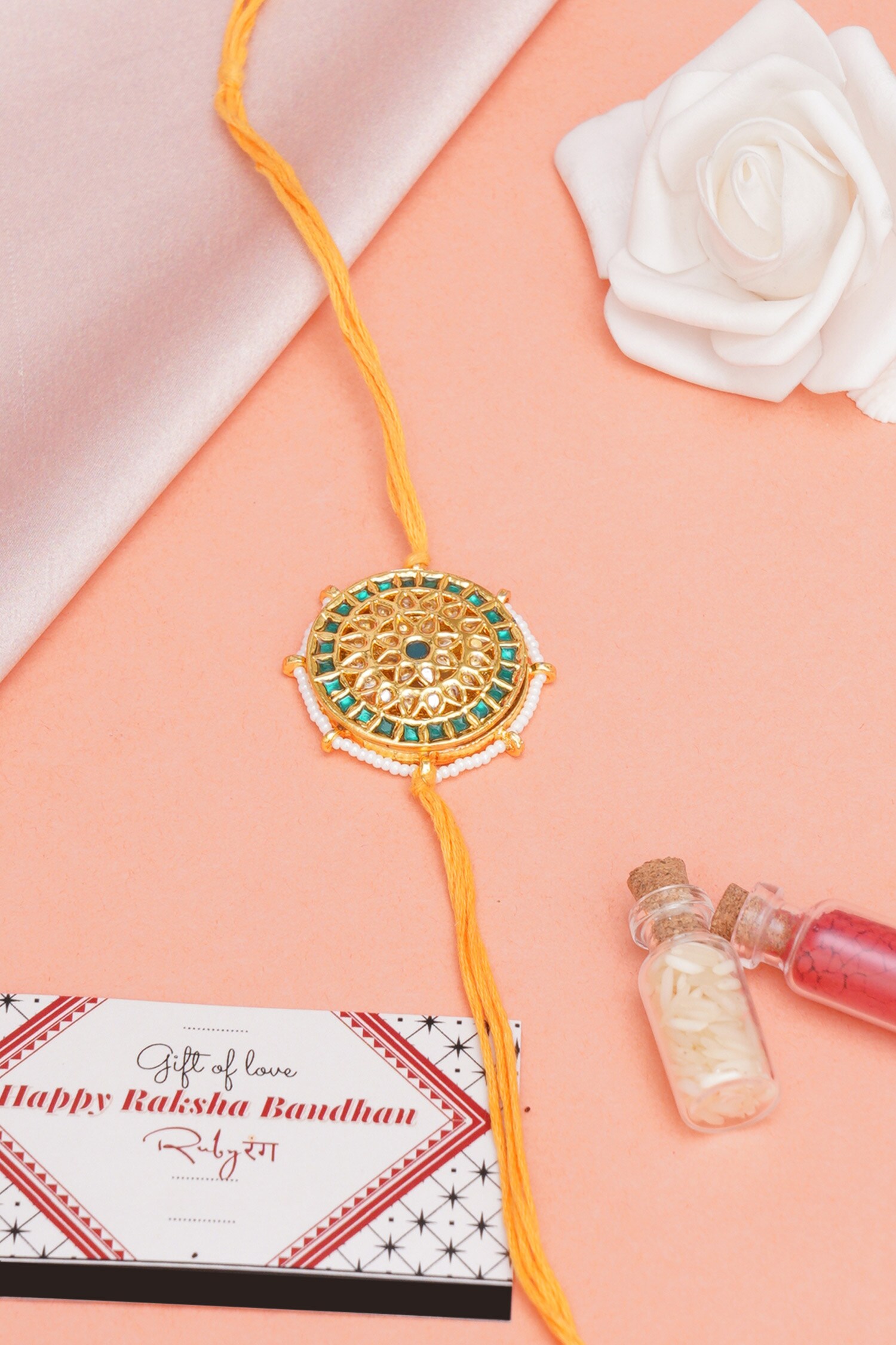 Buy Gold Kundan Stone Handcrafted Floral Carved Rakhi by Ruby Raang ...