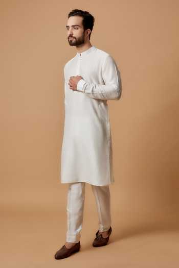 Beige cotton straight kurta set with all-over yellow & purple colored flower hand block print & and side panels.