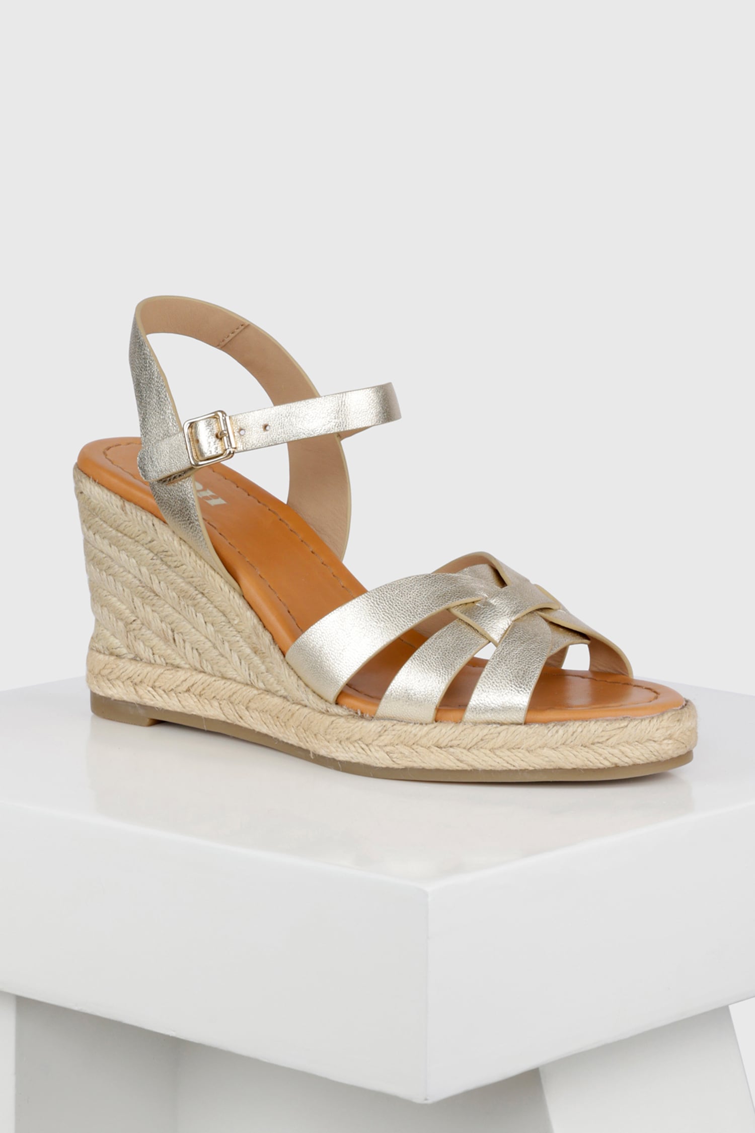 Buy Gold Yute Cutout Strap Wedges by OROH Online at Aza Fashions.