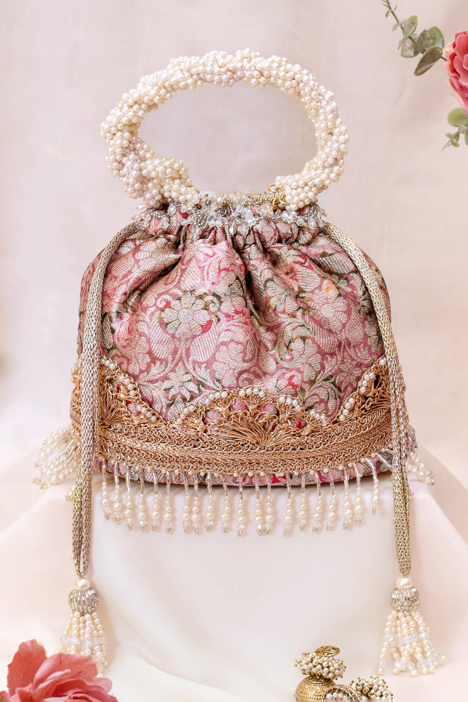 Buy Pink Floral Printed And Embroidered Potli Bag by AMYRA Online at Aza Fashions.