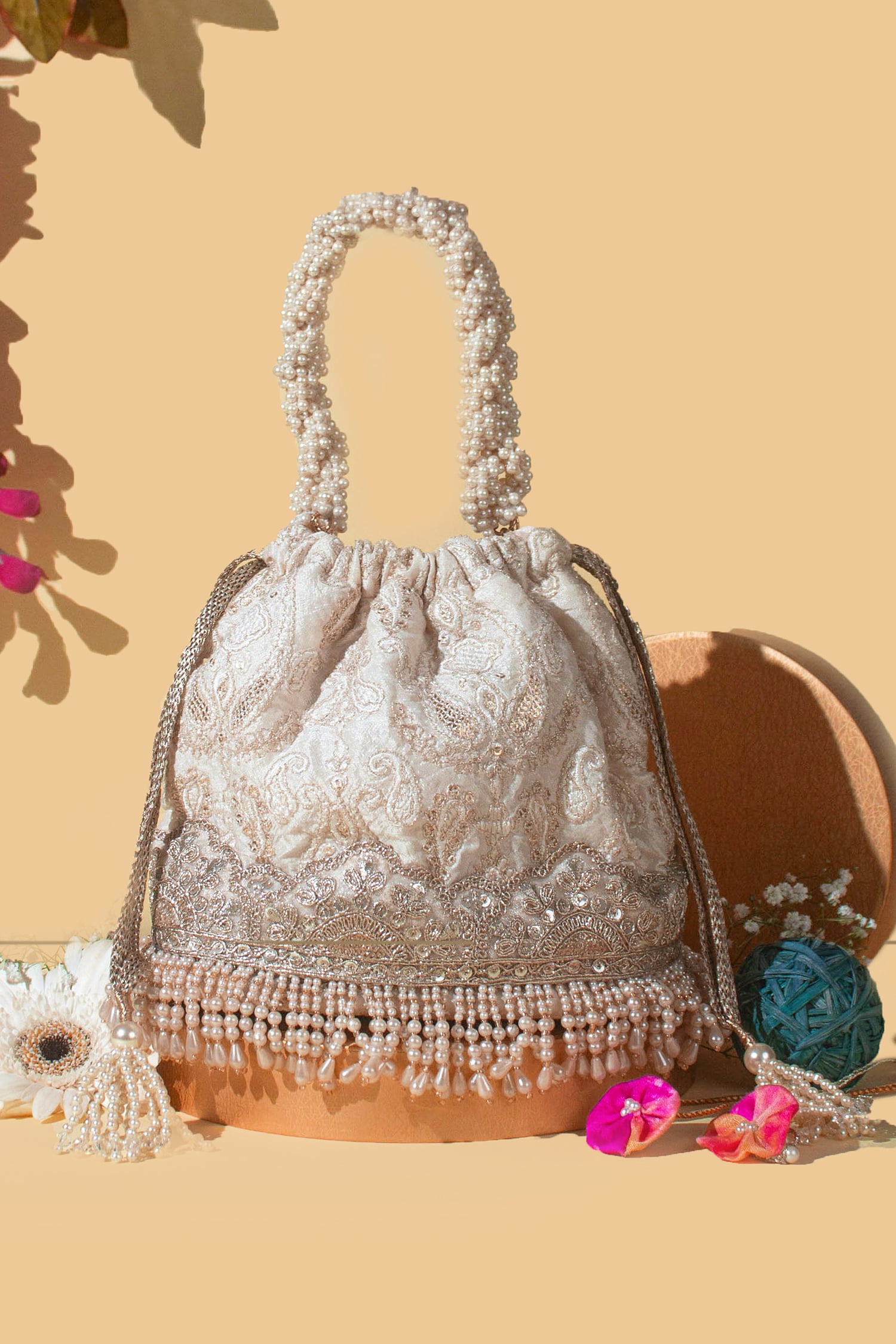 Buy Off White Thread Chaand Embroidered Bucket Bag by Amyra Online at