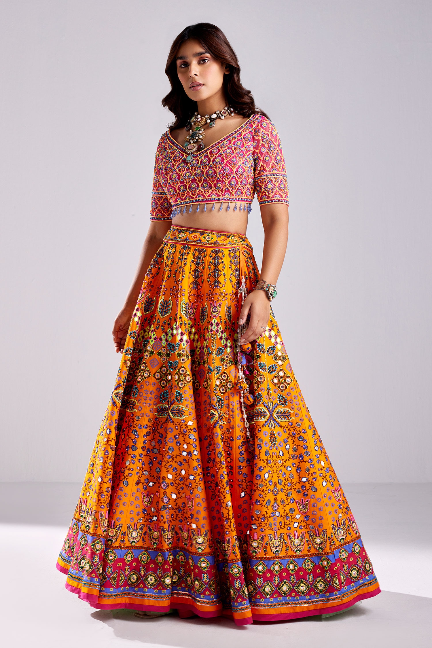 What color of the blouse is suitable for orange lehenga? - Quora