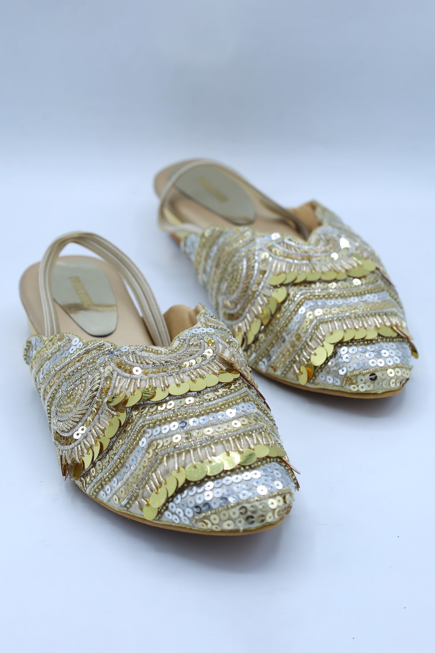 Buy Gold Embellished Kaliaa Heel Mules by Foot Fuel Online at Aza Fashions.