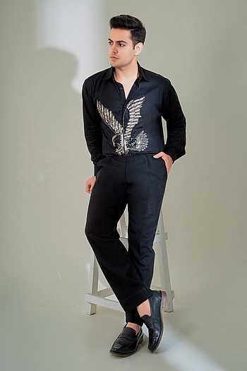 Man in Black Short Sleeve Shirt with Black Sequin Bells