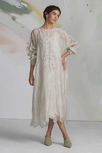 dress design with tissue SAAISHA, Fabric: RICH ZARI TISSUE , Capture the essence of elegance and modesty with this brick shade tissue dress designed specifically for Ramzan. Crafted with delicate tissue fabric, this dress