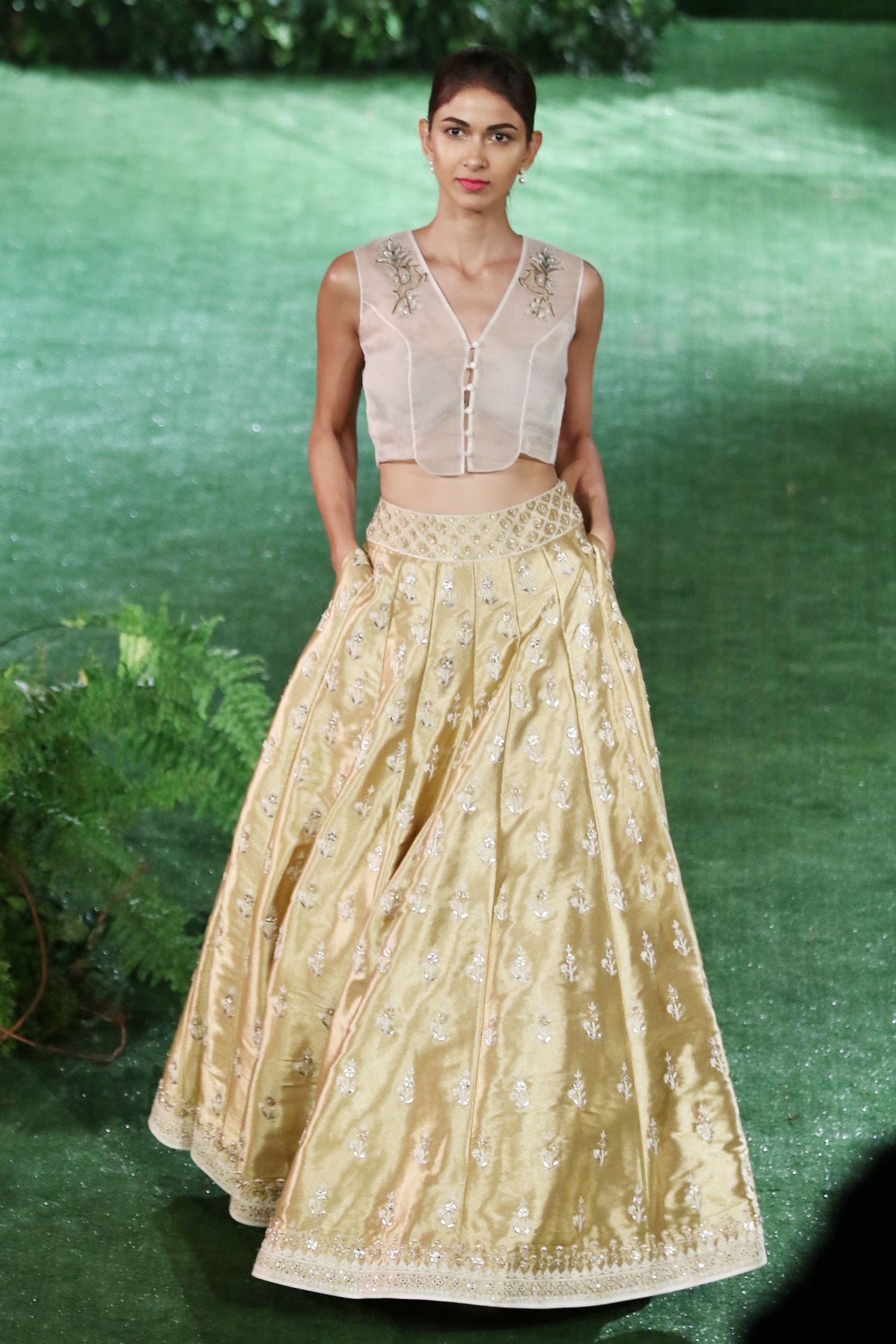 Buy Ivory crop top & gold embroidered lehenga by Anita Dongre at Aza