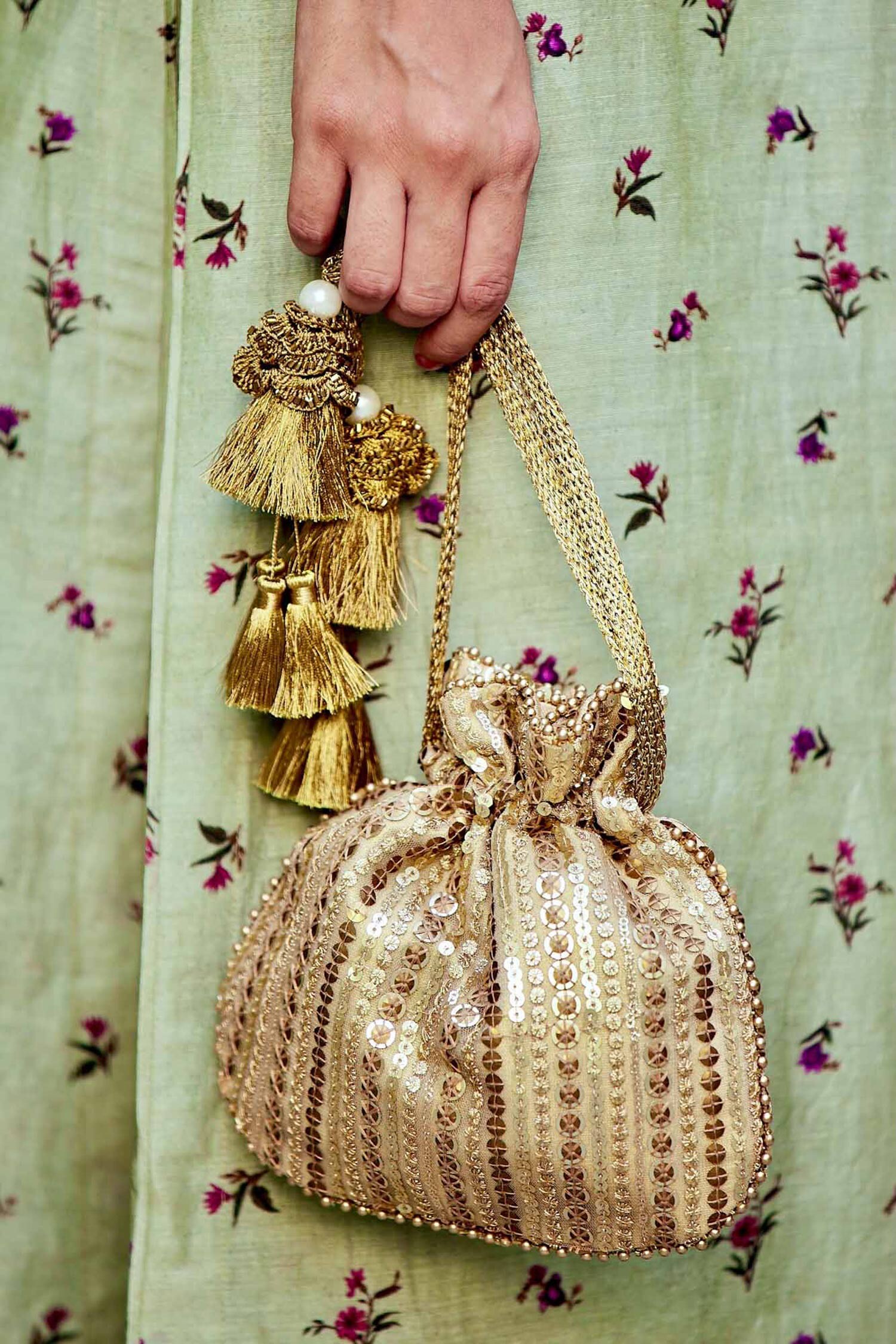 Buy Gold Embroidered Potli Bag by Amyra Online at Aza Fashions