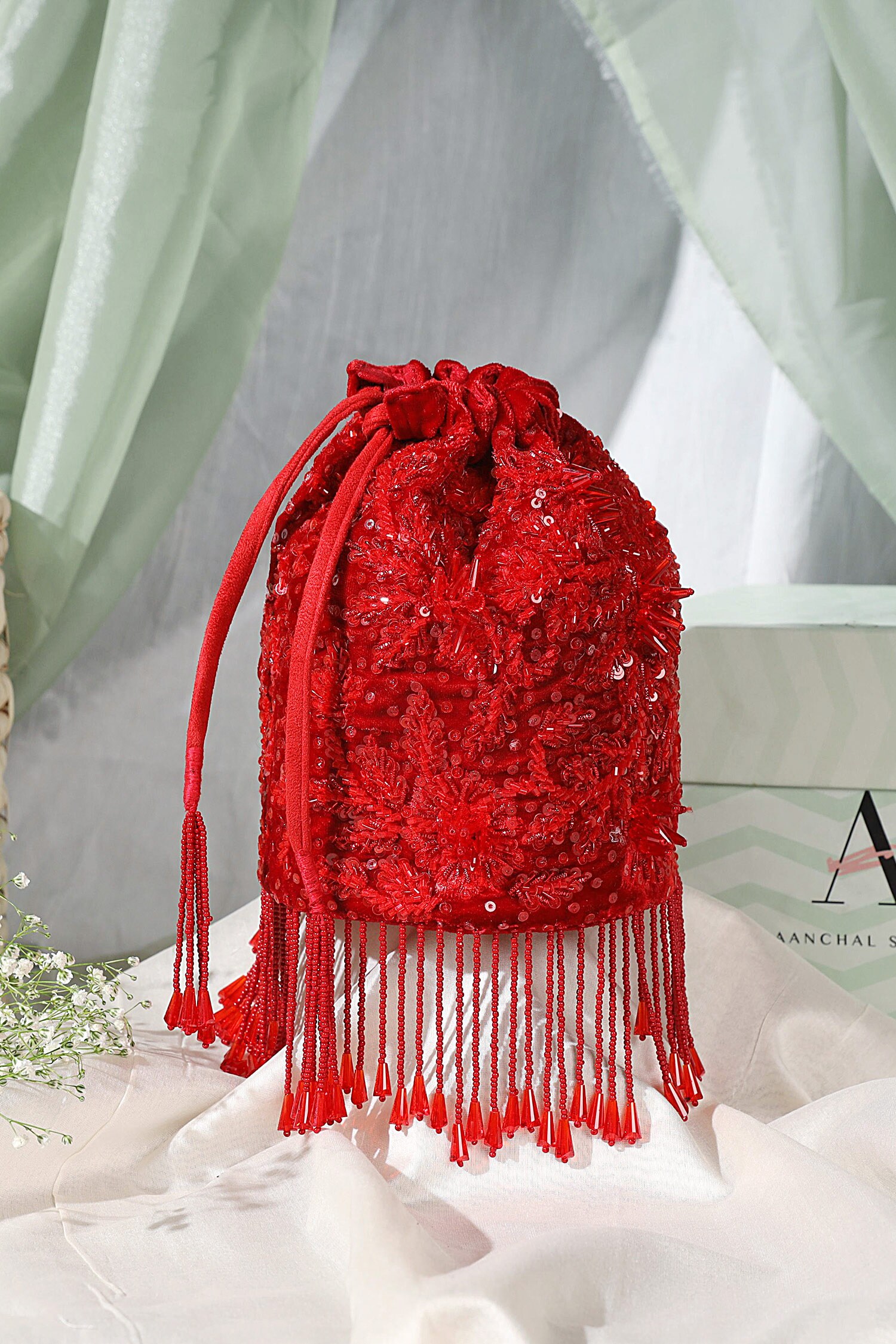 Buy Red Embellished Floral Sequin Tassel Bucket Bag by Aanchal Sayal