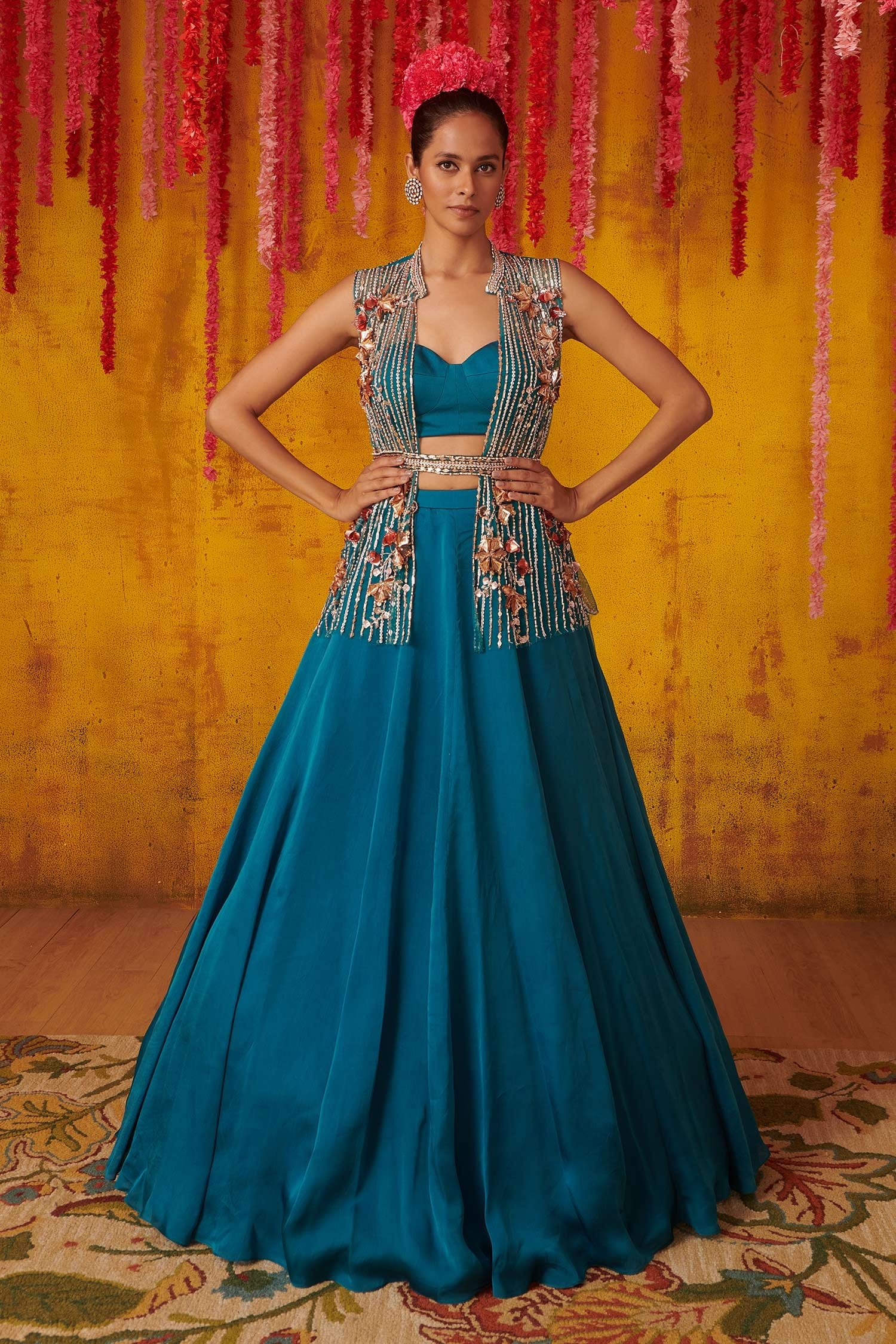 Aza - Here's to feminity with a modern twist! A saree overlayed with a hand  embroidered jacket and clinched at the waist with a bohemian fringed belt  is perfect for an evening