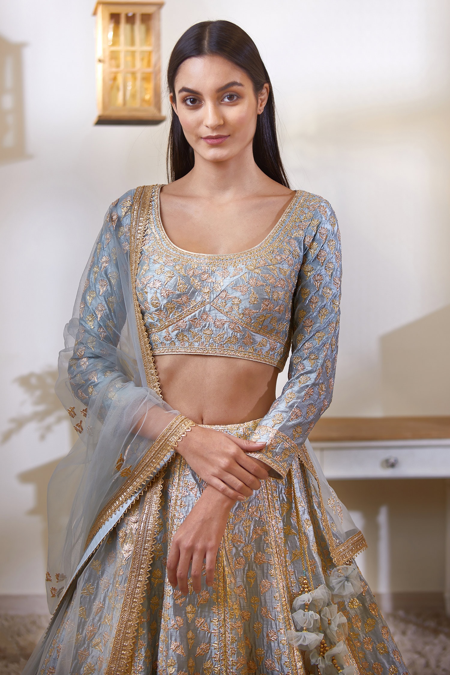 Silver Zari and pearl work based lehenga and blouse based on net  accompanied by a net stone sprayed tassled dup… | Indian bridal outfits,  Indian gowns, Nikkah dress